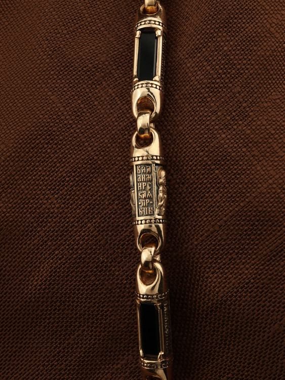 Гайтан из золота c кожаным шнурком и ониксом